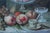 Beautiful modern still life done in the baroque style: staged fruit, glass with reflections of light from an unseen...