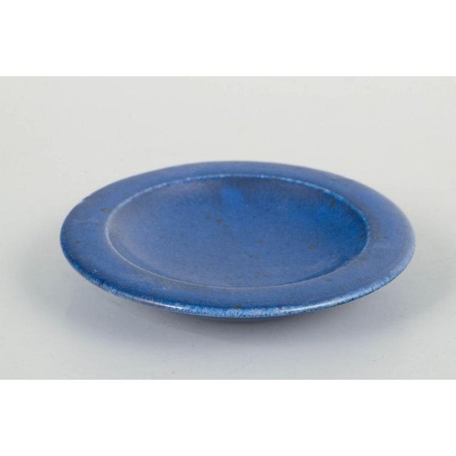 Saxbo Small Dish, Mid 20th Century. Small stoneware dish featuring the characteristic deep blue Saxbo glaze. A refined,...