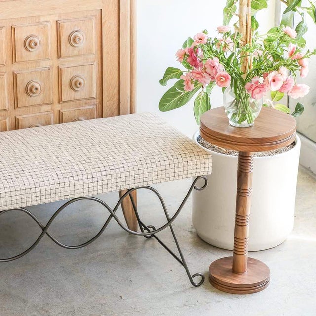 Beautiful iron bench with curved and looped base painted in a matte black finish inspired by French design. Rectangular...