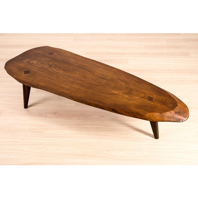 A sculptural Brutalist coffee table, crafted from solid oak in Central Europe, circa 1960s–1970s. The exceptionally thick...