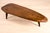 A sculptural Brutalist coffee table, crafted from solid oak in Central Europe, circa 1960s–1970s. The exceptionally thick...
