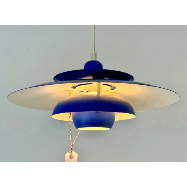 Striking Danish pendant lamp manufactured by EL-Light in the 1970s. The sculptural design is composed of several layered...