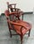 Design Plus Gallery presents a Pair of Vintage Rosewood Corner Chairs. Expertly handcrafted from solid rosewood, this...