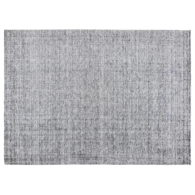 Modern minimalist hand loom rug with plain distressed pile and soft texture.