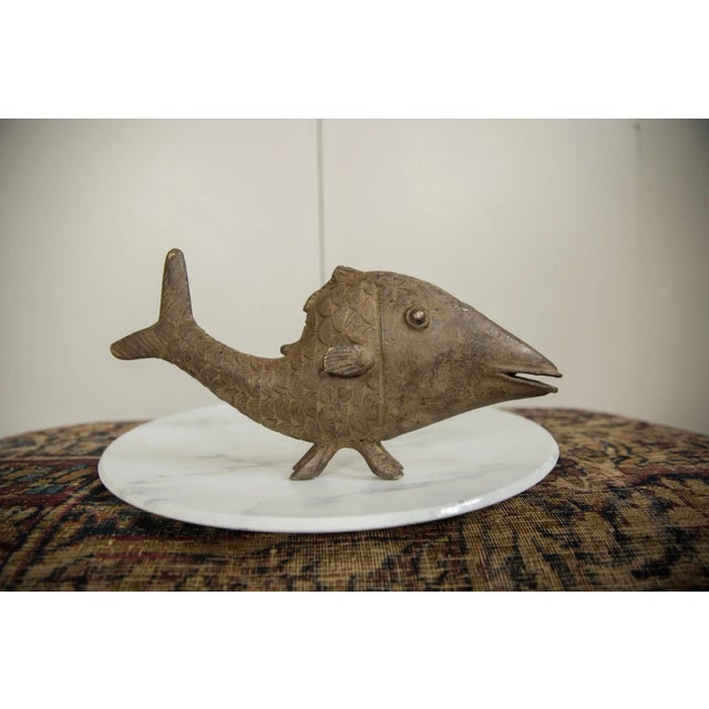 :: Vintage handmade African bronze fish. Circa mid 20th century and possibly older, each figure in this collection...