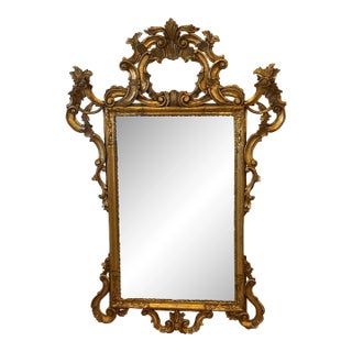 Antique Italian Rococo Rectangular Mirror in Carved Giltwood With Elaborate Foliate Scrollwork and Rossette Flourishes and Embellishments For Sale