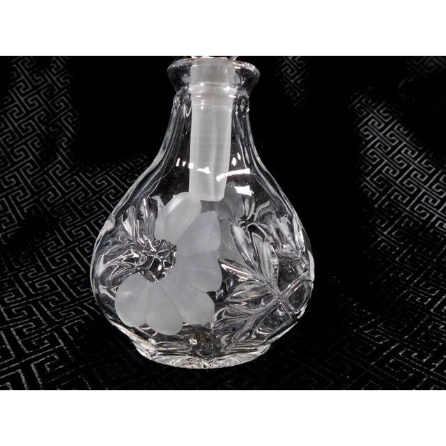 This is a cut, lead crystal perfume bottle by Princess House in the Heritage Romance pattern. The bottle is teardrop...