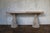 Elegant vintage console table featuring two sculptural pedestal bases, beautifully hand-carved with fruit and foliage...