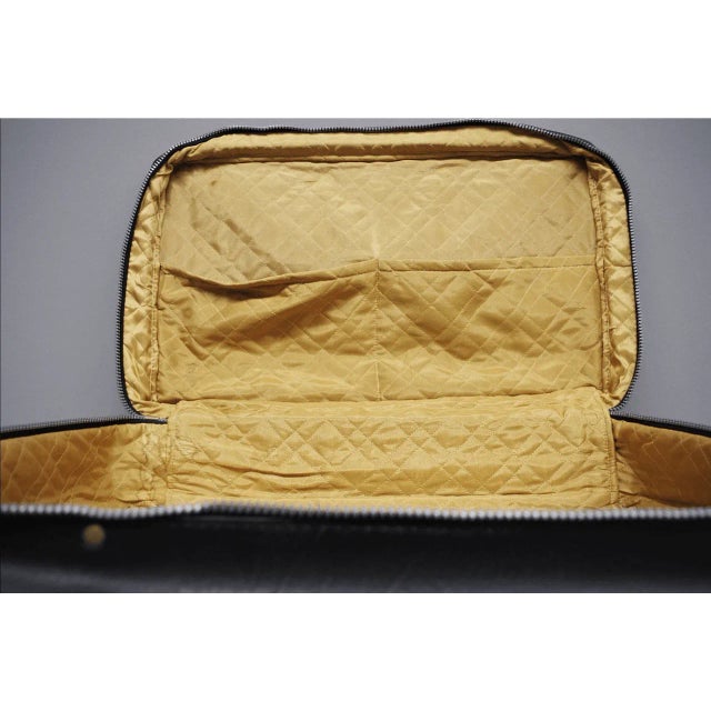 Step back in time with this stunning genuine black leather suitcase/briefcase, an authentic piece of Italian design from...