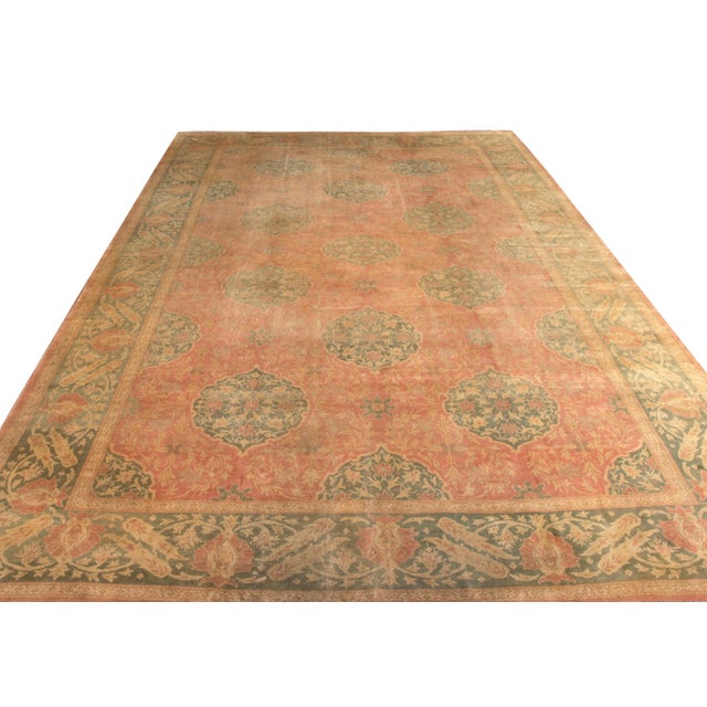 Hand-knotted in wool originating from Turkey circa 1890-1900, this antique rug connotes a unique transitional Oushak rug...