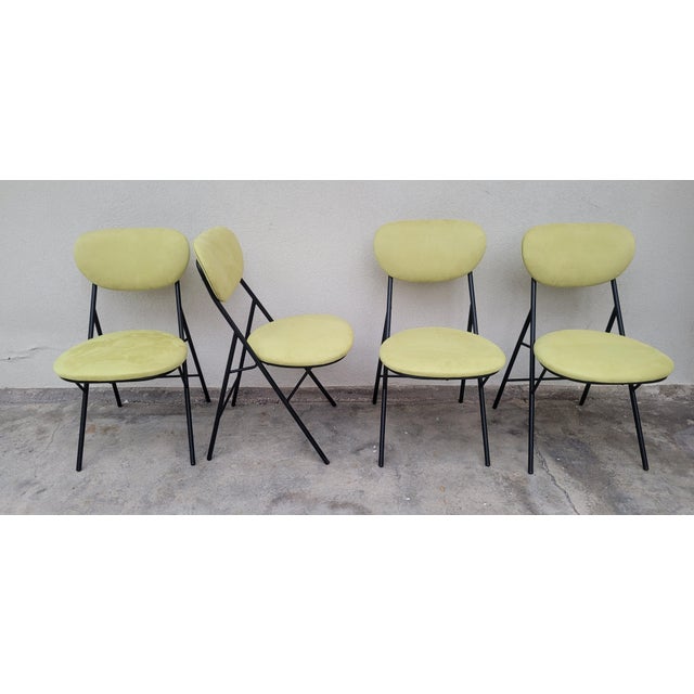 4 Italian-made chairs produced by Amma of Turin in the 1960s. Structure in black painted metal rod. Seat and backrest in...