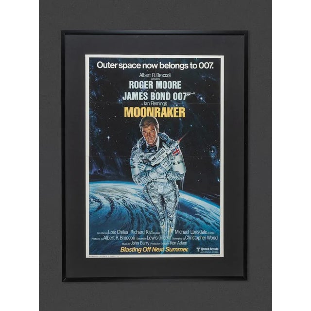 Original vintage announcement poster for the movie "Moonraker" (Blasting Off Next Summer) with Roger Moore as James Bond...
