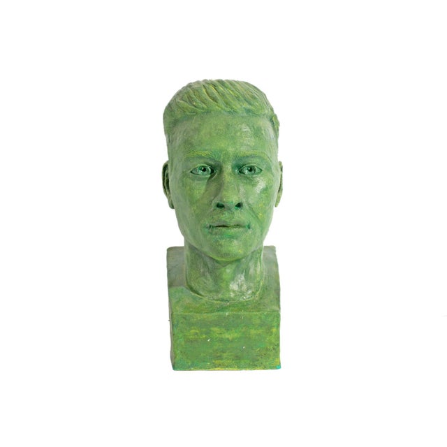 A plaster bust sculpture by the American artist Lillian Harrington. This green sculpture depicts a man with short hair and...