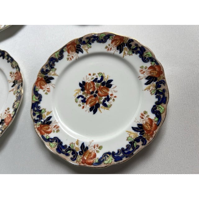 The John Maddock & Sons Majestic Multicolored Smooth 4 Imperfect Bread Plates are elegant and versatile dinnerware pieces...