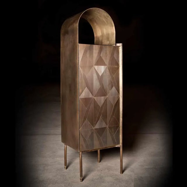 The collection by Alessandro Zambelli comprises a series of storage furniture that includes a small cabinet, a dry bar, a...
