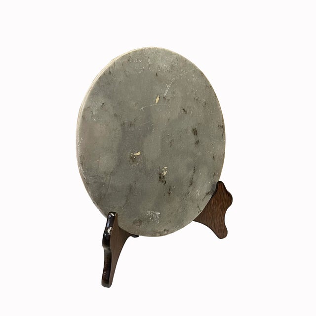 This is a round shape natural stone display with a natural abstract pattern. It is a nice unique accent piece for home...