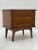 Unique Mid-Century Night Stand with walnut construction, including sculpted drawer fronts, tapered legs and plenty of...