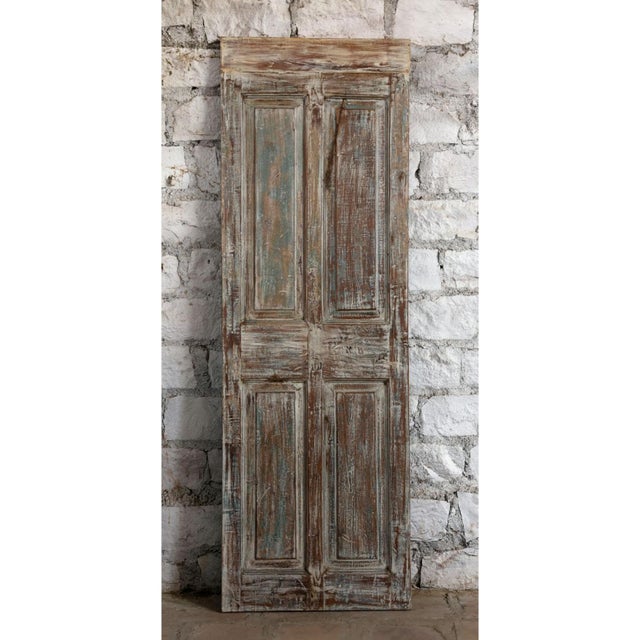 Make a bold design statement with this antique carved door, featuring a beautifully distressed green patina that showcases...