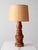 A sculptural vintage table lamp from the 1960s–70s, turned from alternating bands of warm honey-toned and darker wood. The...