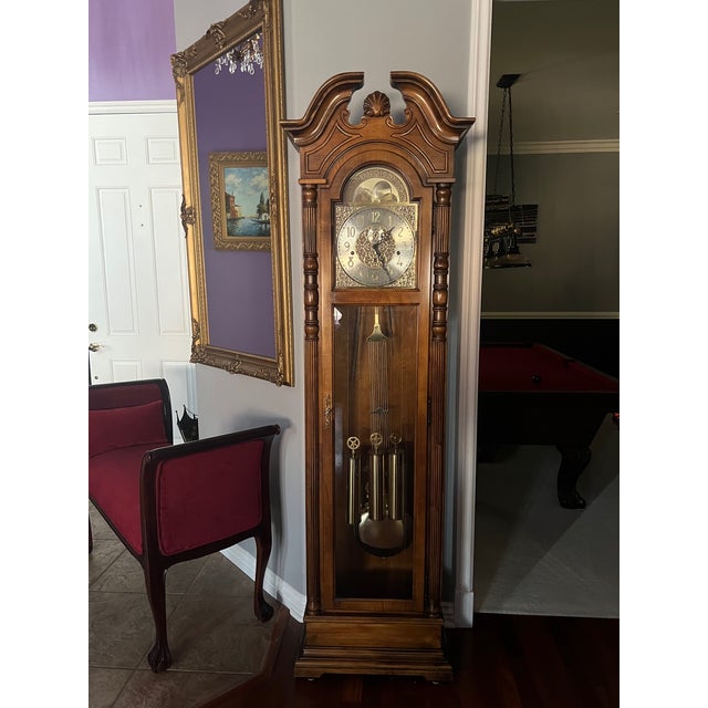 Howard Miller Grandfather Clock has a glass front case that allows you to watch the pendulum and weights move. Beautiful...