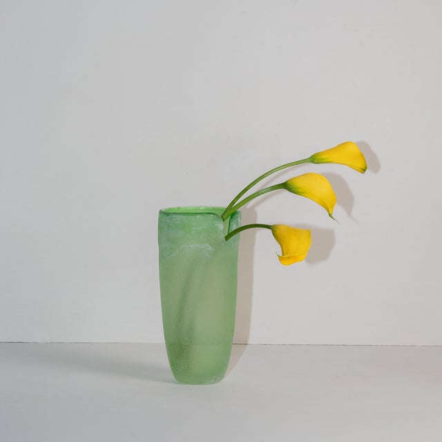 Green, beautifully irregular blown-glass vase. Shiny inside, rough glass exterior with white patina.