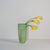Green, beautifully irregular blown-glass vase. Shiny inside, rough glass exterior with white patina.