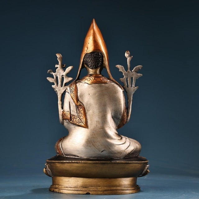 This is a finely crafted antique gilt bronze sculpture of Tsongkhapa, the renowned founder of the Gelug school of Tibetan...