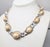 1990s textured rhodium plated oval links with faux-pearl centers with goldtone around the edges collar necklace with hook...