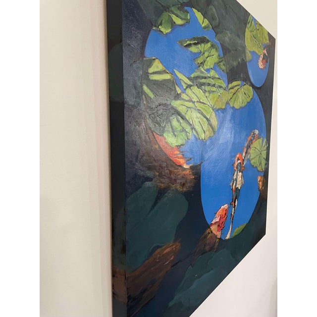 This artwork presents a vibrant interplay of color and form, depicting koi fish amidst lush lily pads against a striking...