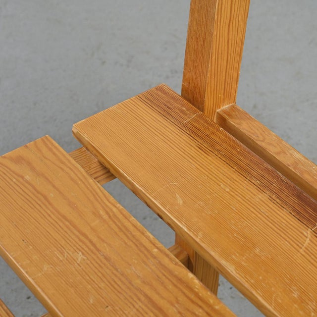 Suite of six solid pine chairs by Maison Regain. The seat is made up of 3 wide slats and a solid backrest. Edition: Maison...