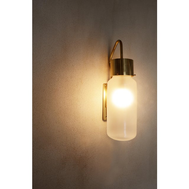 LP10 “bidone” designed by Luigi Caccia Dominioni in the 1958 for Azucena. Brass structure, with adjustable height. White...