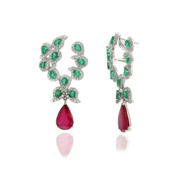 This is part of Chairish’s Fine Jewelry assortment. Emerald, Ruby and Diamond Dangle earrings to make a statement with...