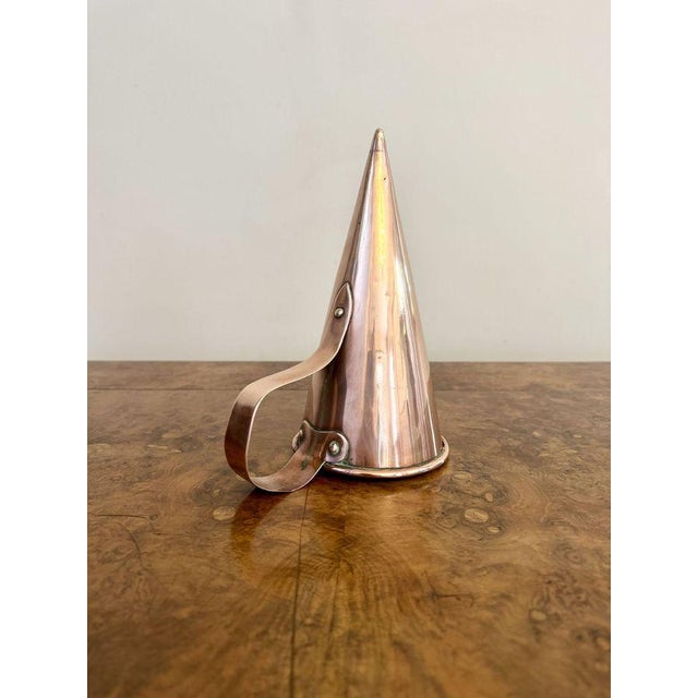 Fine quality antique George III copper measure, having a quality antique original George III copper measure of cone shape...