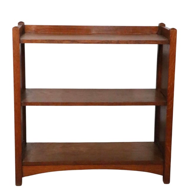 Classic solid oak Arts and Crafts, Mission bookshelf, made by Limberts, circa 1910. The piece features three shelves, and...