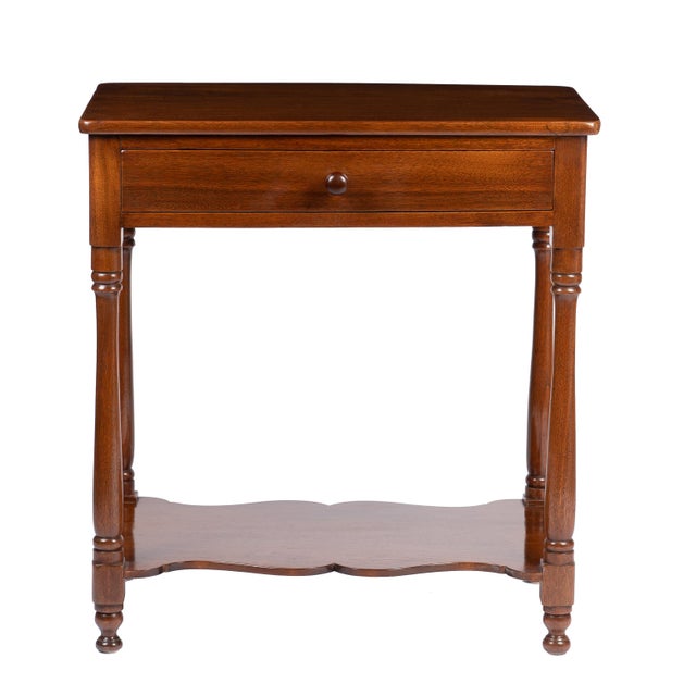 A Delaware Valley single-drawer stand, circa 1810-20, raised on turned legs and joined by a cupid's-bow stretcher shelf....