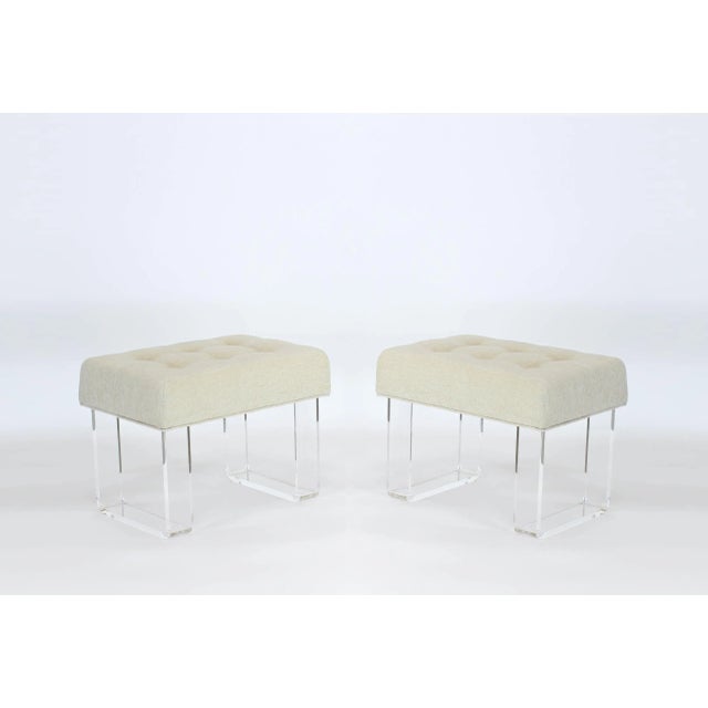 Elegant pair of custom waterfall acrylic benches with upholstered cushion in a lovely cream chenille textile Each acrylic...