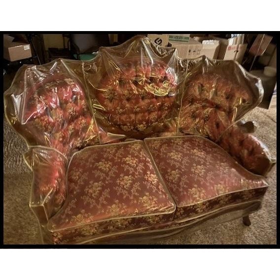 Couch, love seat and chair covered in burgundy fabric with gold trim