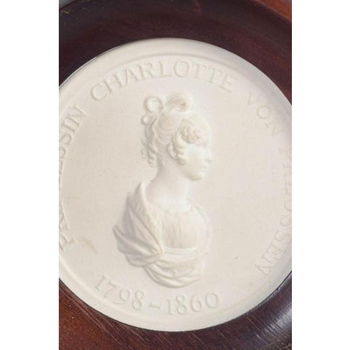 Meissen Biscuit plaque, c. 1970s. Circular relief plaque in white biscuit porcelain with a classical profile portrait of...