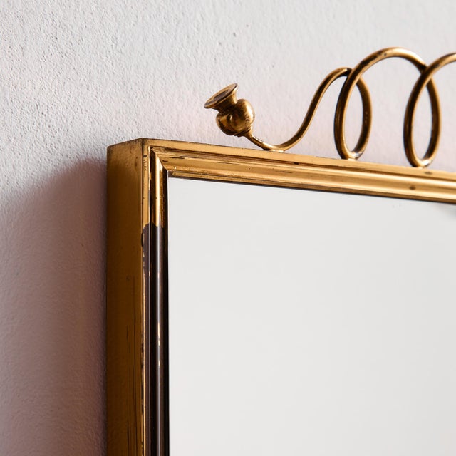 Metal and brass framed mirror from the 1950s. with some surface scratches, stains and wear on the metal parts, but in good...