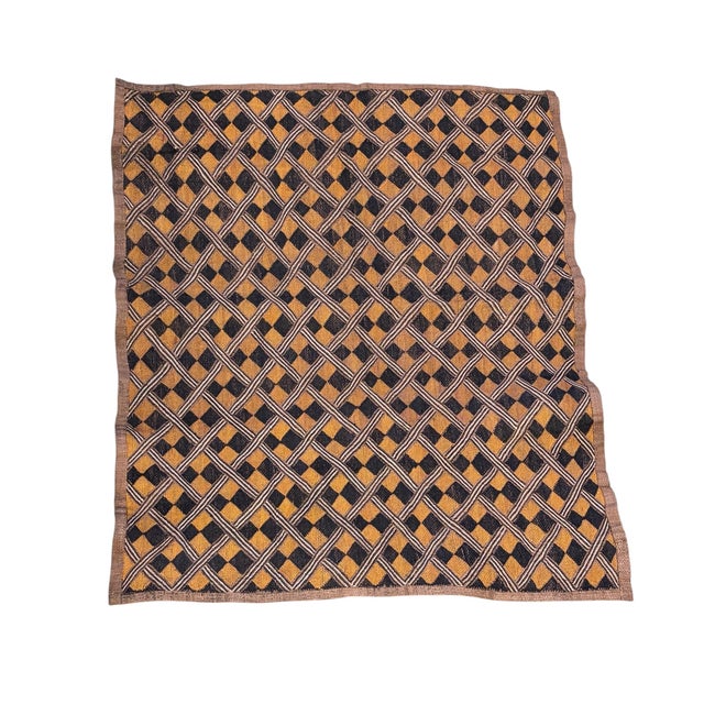 This vintage Kuba Kasai Velvet Boutallah raffia textile from Zaire, Africa, with a geometric pattern hand woven from...
