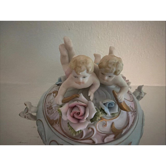 This rare antique Norleans Bisque Candy Trinket Box is a unique and charming piece.