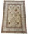 A finely hand-knotted wool area rug inspired by classic Persian Tabriz designs, featuring an elegant allover floral garden...