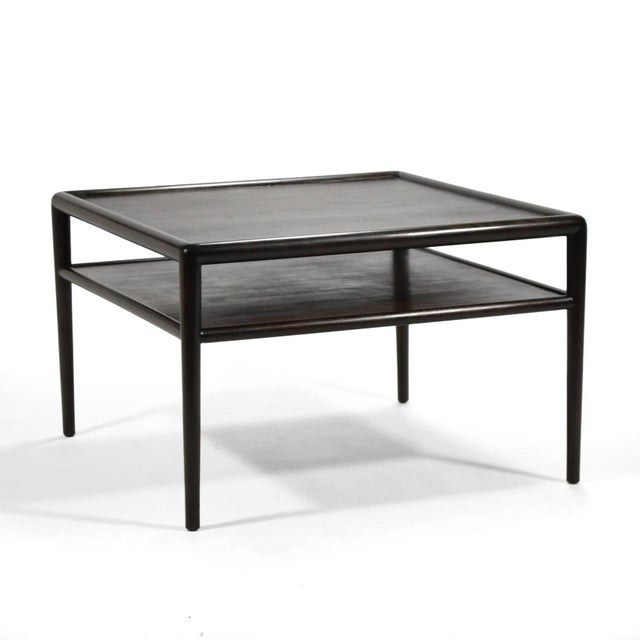 This Robsjohn-Gibbings end table was beautifully crafted of walnut and maple by Widdicomb and is newly restored in a...