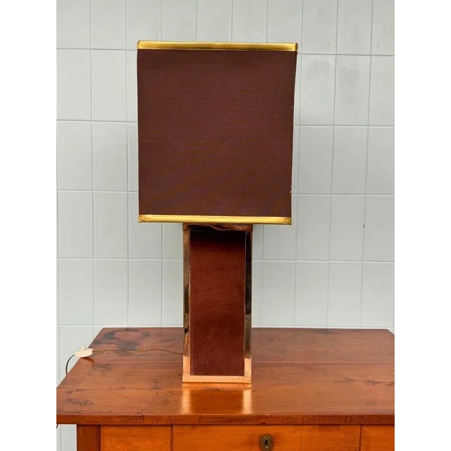 Table lamp with Italian design and manufacturing from the 70s. Lampshade made from a base covered in brown velvet and with...