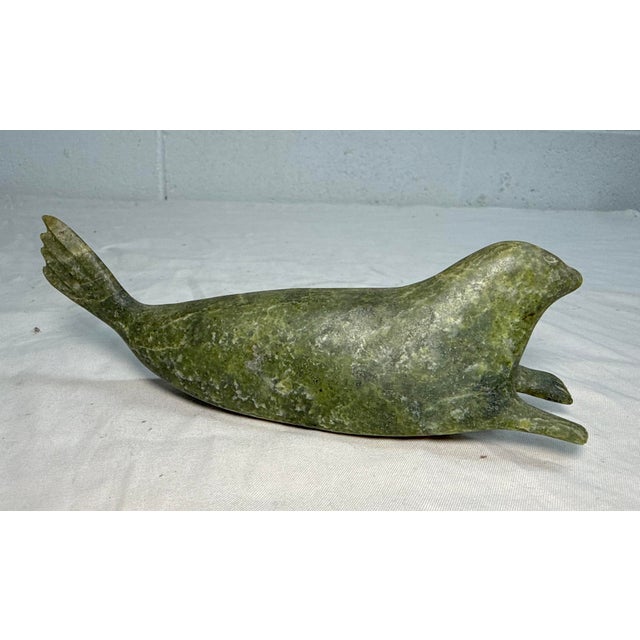 Up for sale is a high quality hand carved antique Canadian Inuit soapstone Eskimo sculpture. It's sculpted out of a solid...