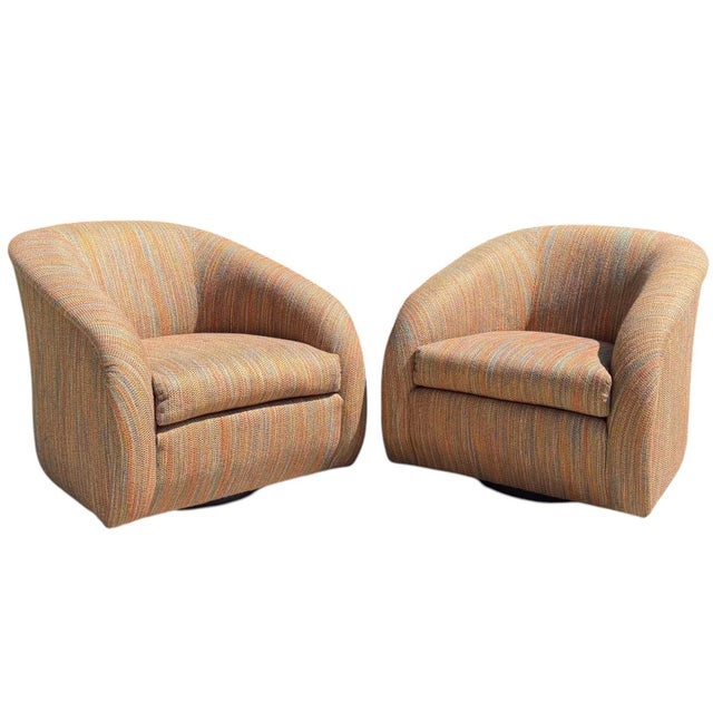 Vintage pair of sculptural swivel barrel lounge chairs by Classic Gallery, Inc., dating to the late 20th century. The...