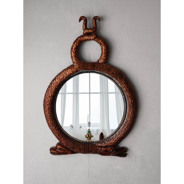 Massive 54" x 37" vintage serpent wall mirror. Large piece that makes an even larger statement. A rare find in this large...