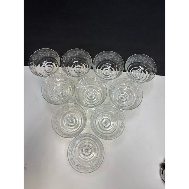 Elegant set of ten vintage etched champagne coupe glasses attributed to Rock Sharpe, featuring a delicate berry and leaf...