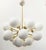 Italian oval shaped sputnik chandelier with 24 matte white Murano glass globes mounted on brass frame in unlacquered...