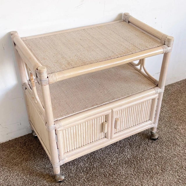 Add a touch of casual elegance to your home with the Boho Chic White Washed Bamboo Rattan and Wicker Bar Cart. The natural...